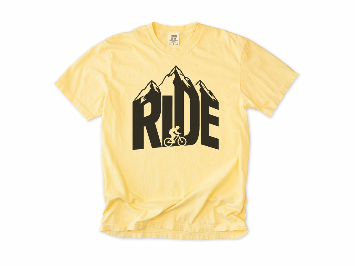 Cycling T-shirt in Butter, 'RIDE' in mountain-shaped letters with a cyclist, for mountain bikers