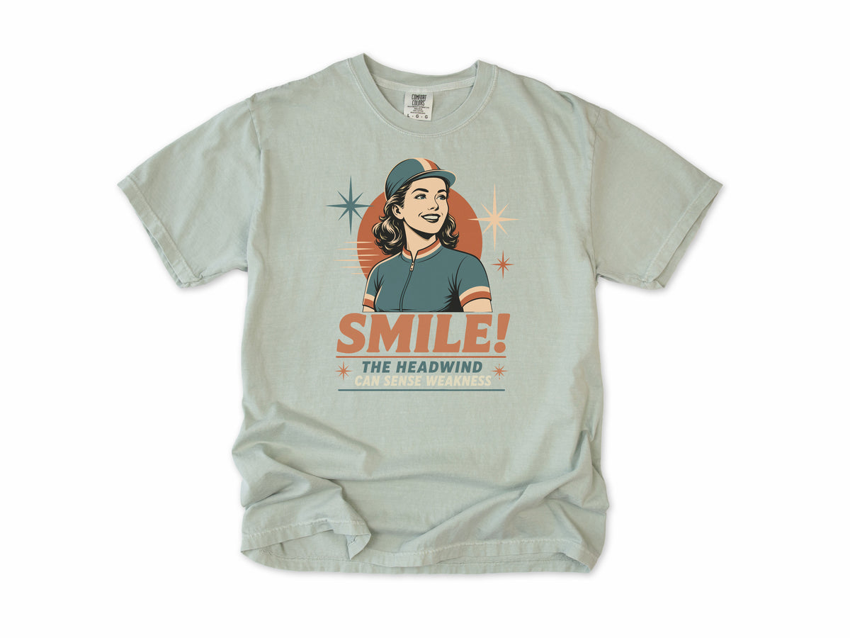Funny cycling T-shirt in Bay, a retro woman cyclist in a cap, 'Smile!', gift for a woman who cycles: mum, wife, sister, daughter, nan