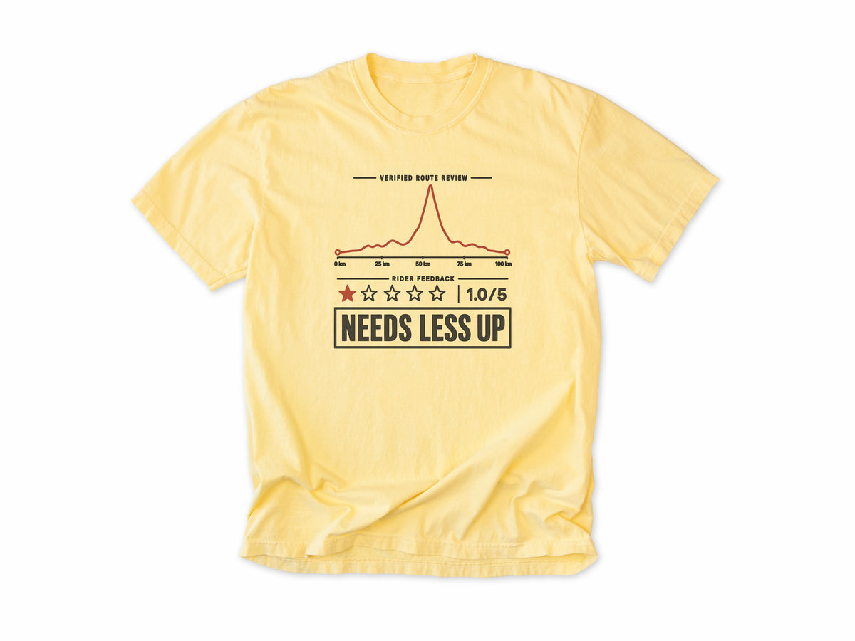 Funny cycling T-shirt in Butter, a one-star route review, 'Needs Less Up', for riders who prefer flat rides